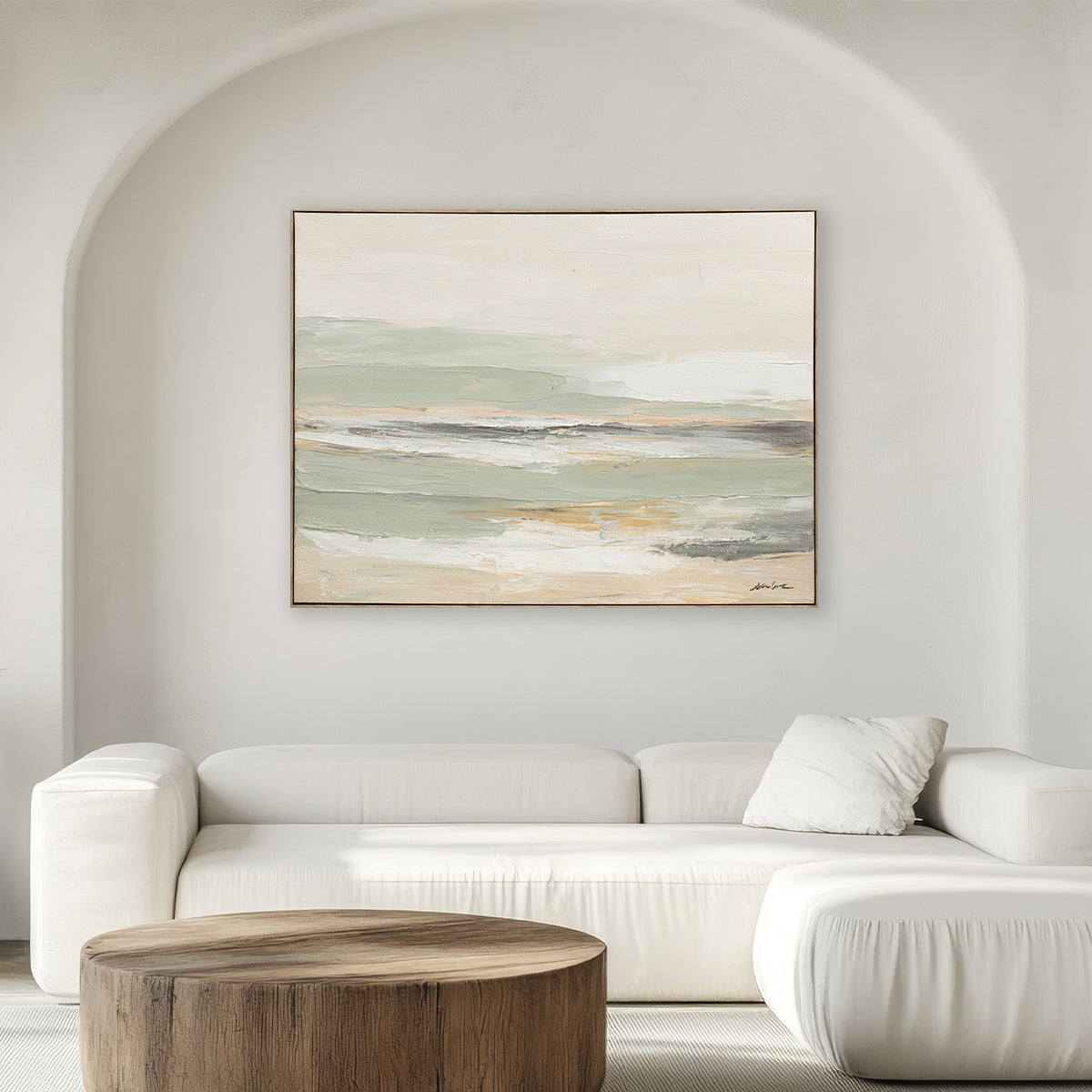 Abstract painting on a wall above a white sofa in a living room.