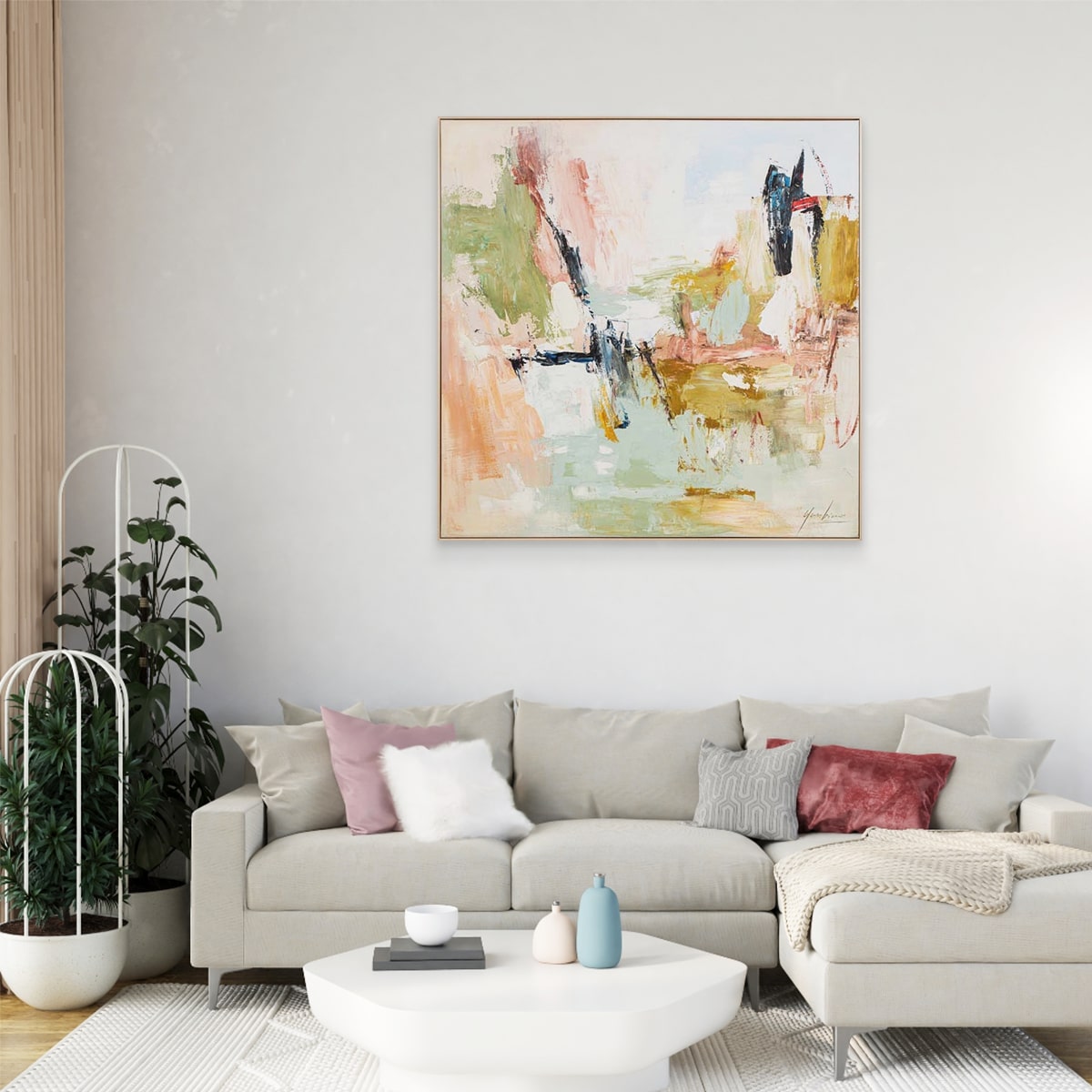 Bloom In Sage in the living room with a gray sofa and decorative items.