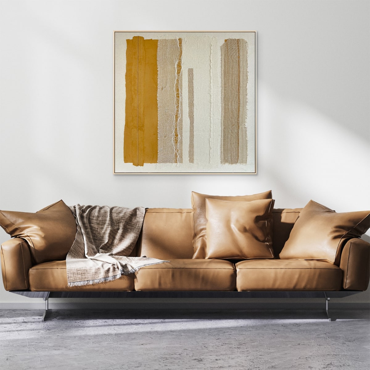 Brown leather sofa with decorative pillows and Plentiful abstract painting in a modern living room.