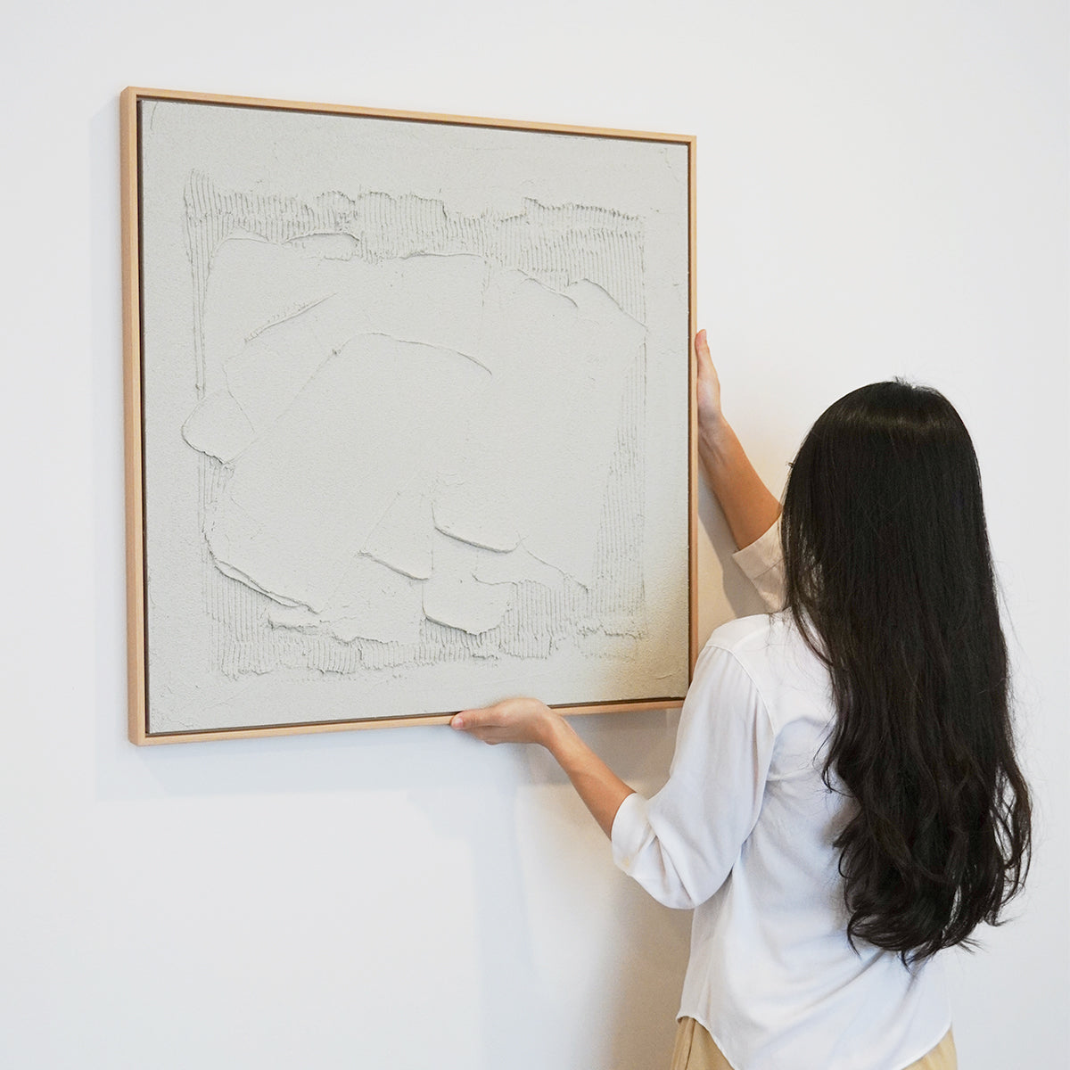 woman hanging Abstract textured wall art affordable oil painting white concrete square