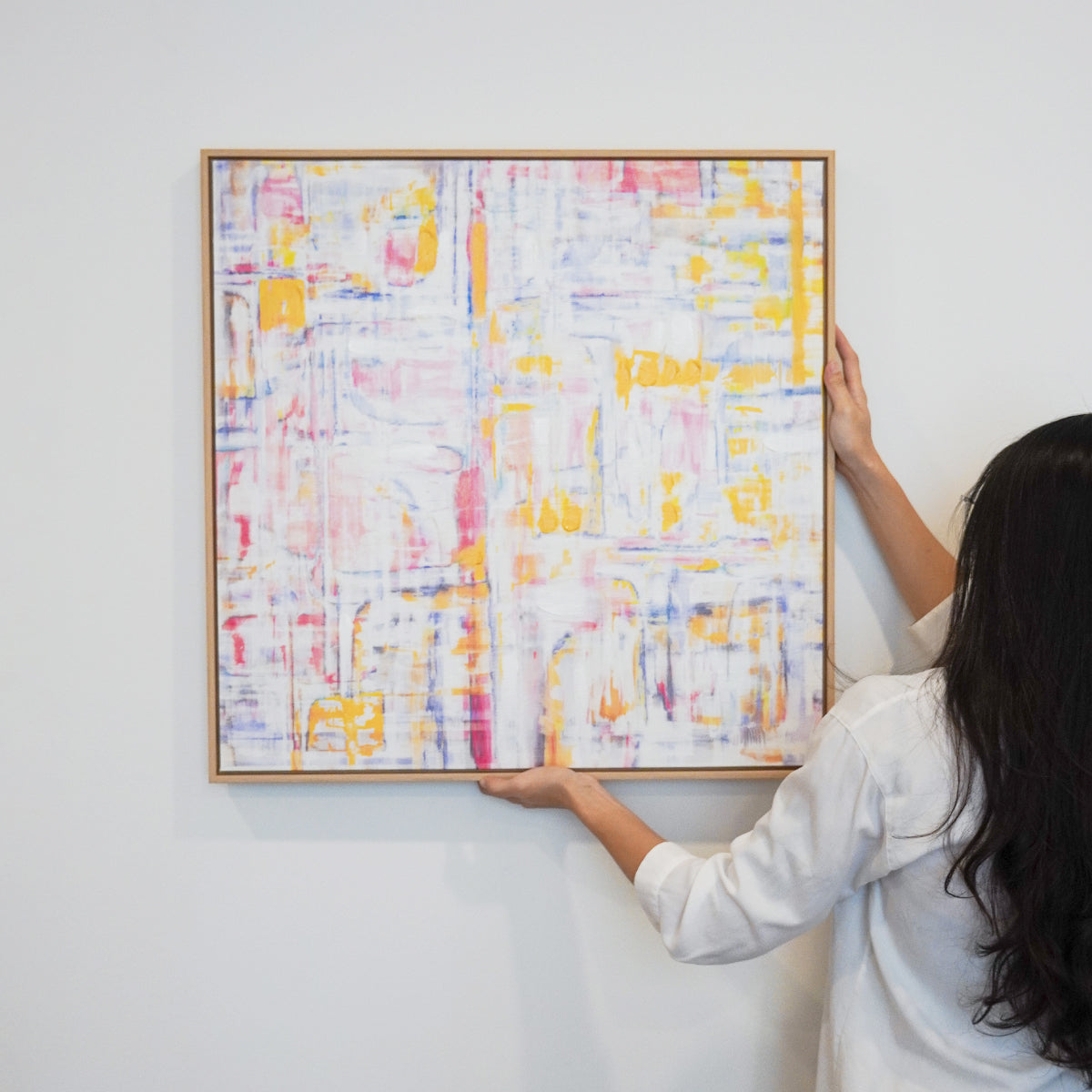 woman hanging Abstract textured wall art affordable oil painting framed colourful square