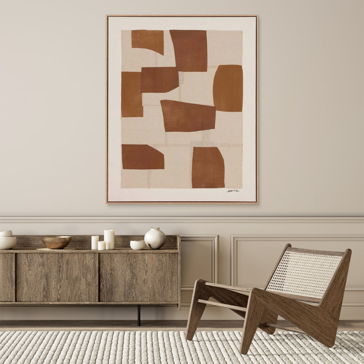 Modern interior with Umber abstract wall art hung up, alongside a wooden cabinet, and chair.